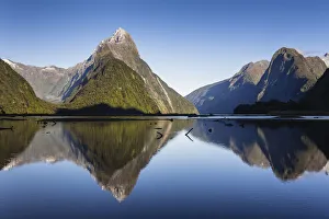 Early morning light on Mitre Peak (1683m) reflected in the calm waters of Milford
