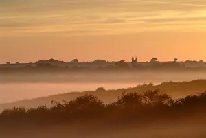 Villages Prints: Early morning mist, looking toward Bradworthy village and church, Devon, UK