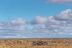 Phenomenon Prints: Farm gate with Andean mountains and associated mirages in the Patagonia desert along Ruta40
