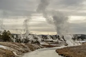 Steam Prints: The Firehole River flowing past hot springs and geysers of the Old Faithful geothermal area at sunset
