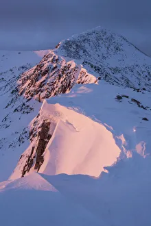 First light on Ben Starav ridge in full winter conditions. Glen Etive, Highlands of Scotland