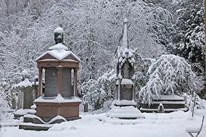 Monuments Prints: Gravestones covered in snow, Highgate cemetery, London, England, UK. December, 2022