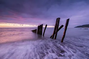 Photographic Effect Prints: Groynes backlit at dusk, Porlock Weir, Somerset, England, UK. June, 2024