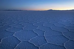 Altitude Prints: Hexagonal shapes on surface of salt flats pre-dawn