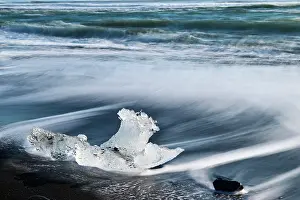 Volcano Prints: Ice on black, volcanic sand beach with waves on glacial lake
