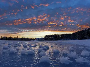 Cloud Prints: Ice crystals on frozen lake at dawn, Upper Bavaria, Germany. January, 2024
