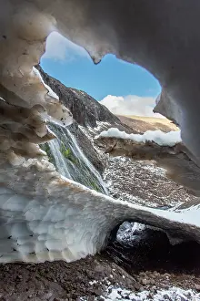 Chubut Prints: Ice tunnel adjacent to a waterfall above the treeline in Los Alerces National Park