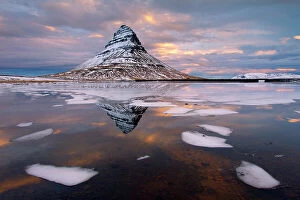 Tranquility Collection: Kirkjufell mountain at dawn with ice in foreground, Snaefellsnes peninsula, Iceland