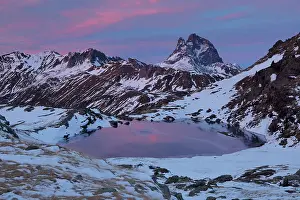 Summit Prints: Lake in snow-covered mountains at dusk