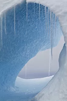 Antarctic Peninsula Gallery: A large hole in an iceberg with icicles hanging. Yalour Islands, Antarctic Peninsula