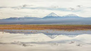 Chile Prints: Licancabur volcano and surrounding mountains reflected in waters of a severe flood caused by climate change