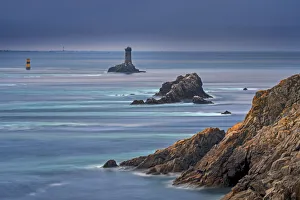 Bretagne Prints: The lighthouse La Vieille in the strait Raz de Sein at dusk at the Pointe du Raz, Plogoff