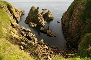 Looking down at eroded rocks off the coast of Buchan, Aberdeenshire, Scotland, August 2010