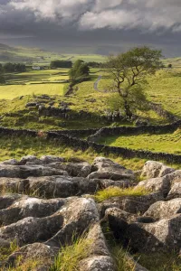 Malham Moor, with stormy skies over Winskill and Ribblesdale with Pen-y-Ghent shrouded in cloud
