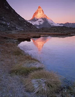 Matterhorn (4, 478m) at sunrise with reflection in Riffel Lake, Wallis, Switzerland