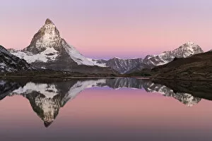 Images Dated 26th October 2008: Matterhorn at sunrise in autumn with reflection in the Riffelsee. Zermatt, Valais