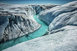 Cool coloured wilderness Collection: Meltwater river running through the Greenland ice cap, June 2013