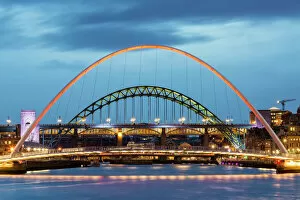 Flowing Water Collection: Millennium Bridge illuminated at dusk, River Tyne, Newcastle, Tyne and Wear, England