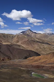 Mineral rich landscape and copper lake from the Bogo La pass at17000 ft, Tibet Mineral rich landscape and copper lake from the Bogo La pass at17000 ft, Tibet