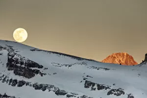Moonrise over a mountain landscape in the evening. Leukerbad, Wallis, Valais
