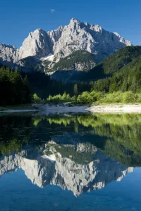 Lakes Prints: Mount Prisojnik (2, 547m) with reflection in a small pond beside the river Pisnica