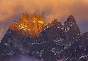 Mountain Peaks at dusk, from left to right, Aiguille de Blaitiere, Aiguille de Cigeaux Mountain Peaks at dusk, from left to right, Aiguille de Blaitiere, Aiguille de Cigeaux
