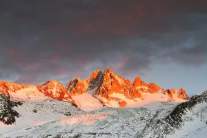 Mountains in snow, Aiguille du Tour with Tower Glacier in front. Sunset with a dark sky. Chamonix, Haute Savoie, France, December 2011