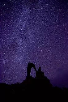 Night sky over Stone arch, called the Julia arch. Ennedi Natural and Cultural Reserve