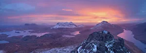 Summit Prints: Panoramic view of a colourful winter sunrise from the summit of Stac Pollaidh