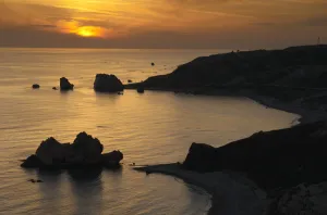 Cyprus Prints: Petra tou Romiou (Aphrodites Rock) silhouetted at sunset, Pissouri Bay, near Paphos