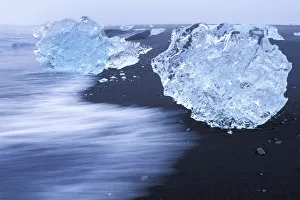 Time Exposure Prints: Pieces of iceberg calved from Vatnajokull glacier on black sand beach, Iceland 2005