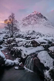 Pink Gallery: Pink sky at sunrise over a snow-covered landscape and highland stream