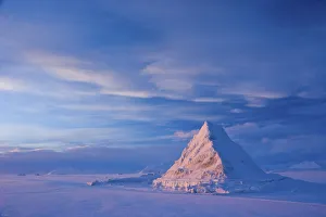 Sea Ice Prints: Pyramid of sea ice catching the first rays of the returning sun in the high Arctic