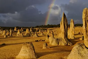 Rainbow over the Limestone formations in the Pinnacles desert, Nambung National Park
