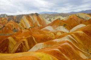 Sandstone Prints: Rainbow Mountains, strata within eroded hills of sedimentary conglomerate and sandstone