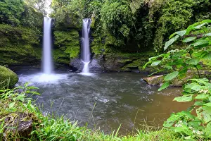 Blurred Movement Prints: Rainforest waterfall flowing over moss-covered rocks in buffer zone of Sumaco National Park