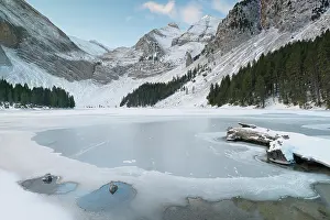 Freshness Prints: RF - Frozen lake surrounded by snow-covered mountains in winter