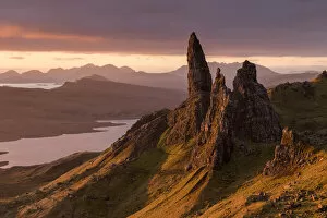 RF - The Old Man of Storr at sunrise, view down to Loch Leathan and mountains