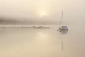 Ross Hoddinott Collection: RF - Sailing boat in mist at sunrise, reflected in Wimbleball Lake
