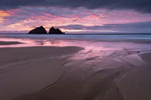 RF - Sunset over Holywell Bay, beach at low tide with sea stacks reflected in water