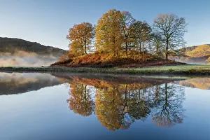 Mist Prints: The River Brathay on a misty morning with autumnal trees reflecting in the water