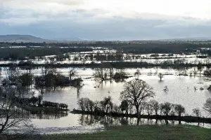 Herefordshire Prints: River Lugg floodwater covering the landscape with train on an embankment over the flood plain