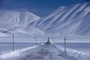Transportation Prints: The road across the Piano Grande in winter. Monti Sibillini National Park, Umbria