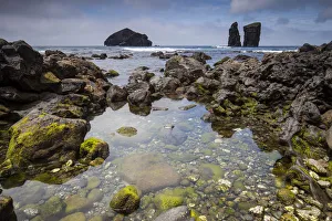 Azores Prints: Rock pool in volcanic rock. Sea stacks and island in background