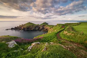 Path Prints: The Rumps, Pentire Head in late evening light with the South West Coast Path