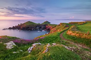 Path Prints: The Rumps, Pentire Head in late evening light with the South West Coast Path