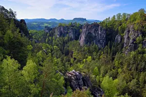 Sandstone Prints: Sandstone rock formations and cliffs with mixed forest in valley