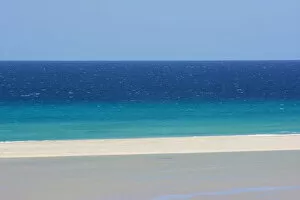 Sandy beach and bright blue ocean, Fuerteventura, Canary Islands. April 2013