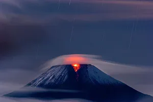 Dramatic Prints: Sangay volcano erupting at night covered in low cloud