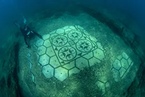 Culture Prints: Scuba diver exploring splendid ancient Roman tessellatum mosaic in black and white decorated with pattern of hexagons